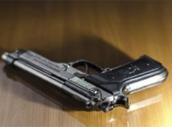 Handgun on a wooden table
